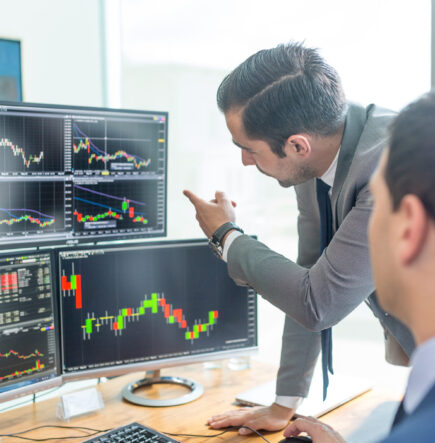 People Looking At Trading Chart