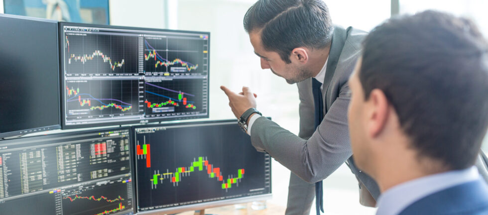 People Looking At Trading Chart